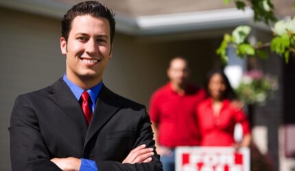 Real estate agent with home sellers